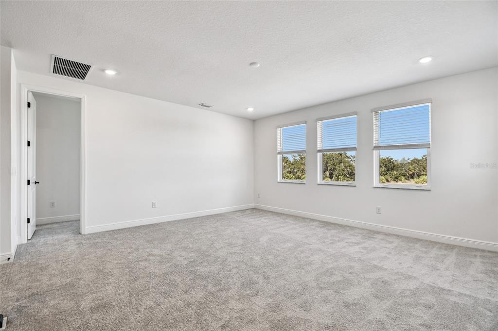 3677 142nd Terrace Parrish, FL 34219 - Photo 25 of 93 an empty room with windows