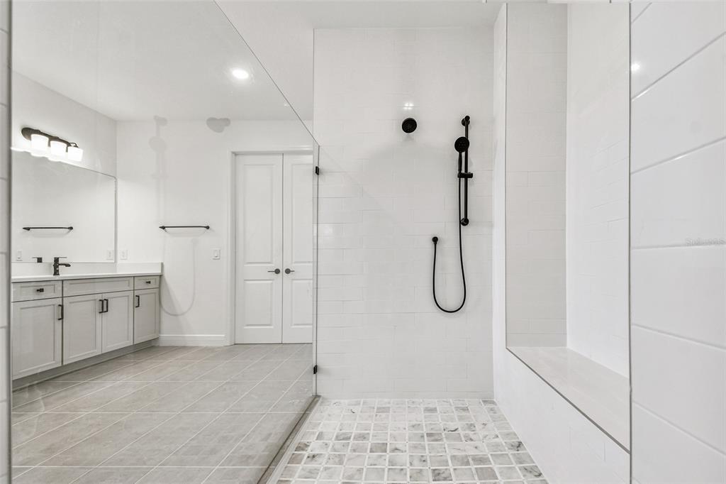 3677 142nd Terrace Parrish, FL 34219 - Photo 32 of 93 a bathroom with a granite countertop shower mirror and a sink