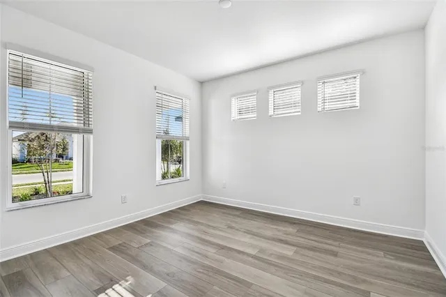 a view of an entryway with wooden floor