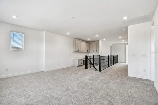 an aerial view of a house with a big yard