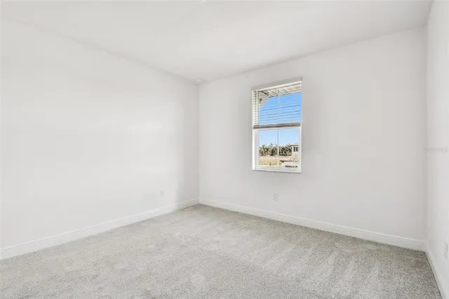a view of living room with furniture and floor to ceiling window