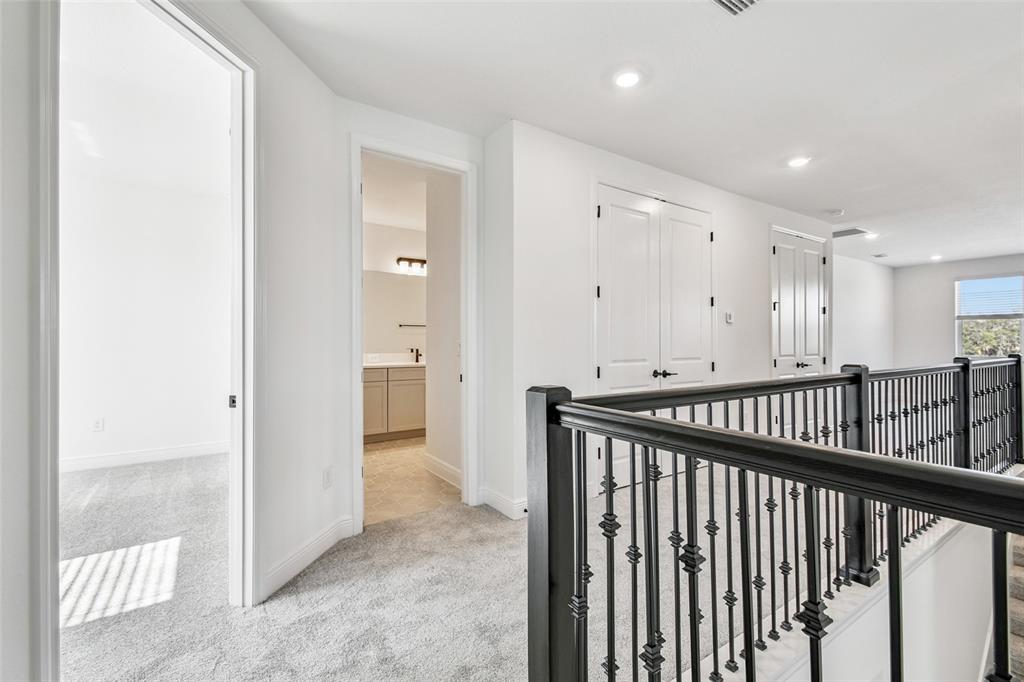 3677 142nd Terrace Parrish, FL 34219 - Photo 44 of 93 a view of a hallway with wooden floor and windows