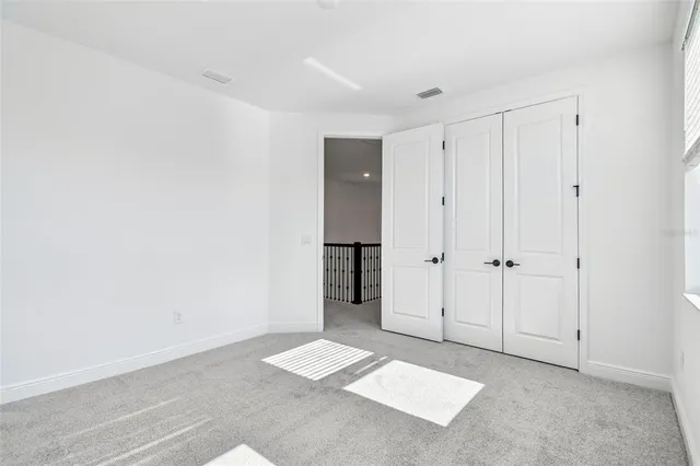 a view of a house with backyard and garden