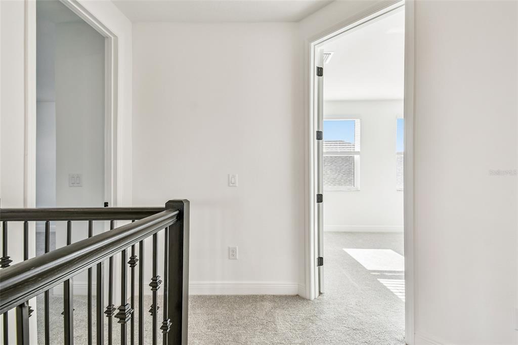 3677 142nd Terrace Parrish, FL 34219 - Photo 54 of 93 a view of a bathroom from the hallway