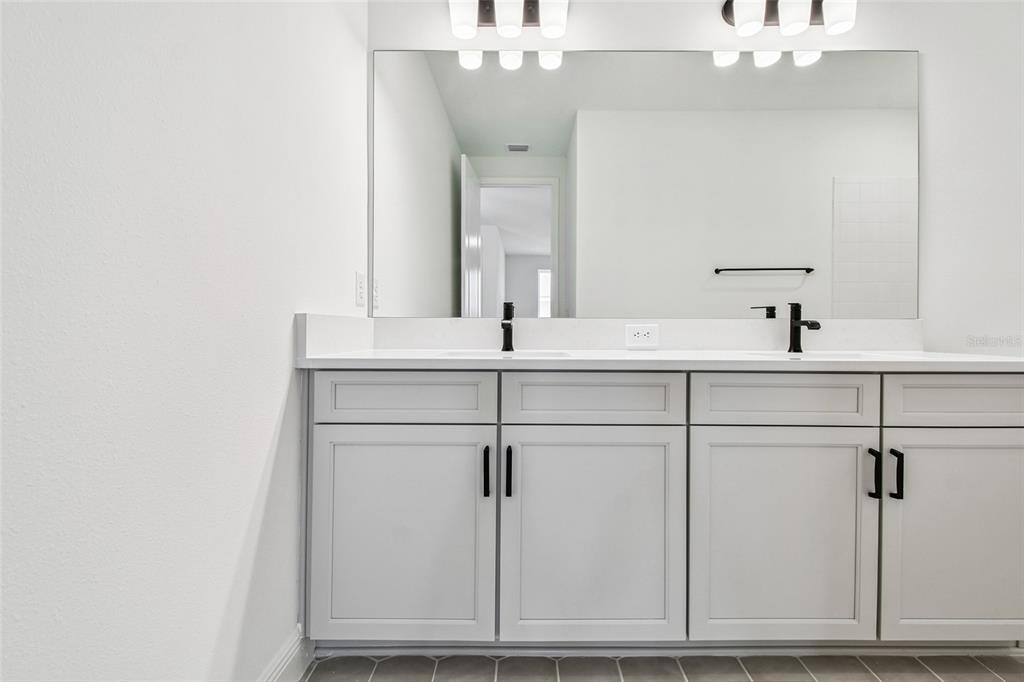 3677 142nd Terrace Parrish, FL 34219 - Photo 57 of 93 a close view of a sink and a mirror