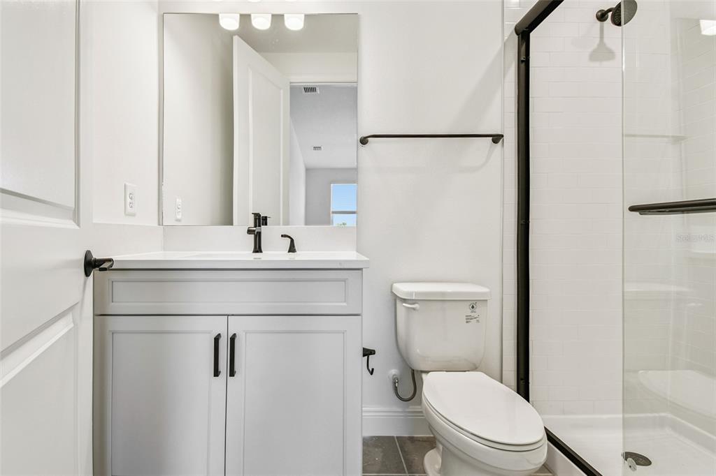 3677 142nd Terrace Parrish, FL 34219 - Photo 61 of 93 a bathroom with a sink toilet and shower