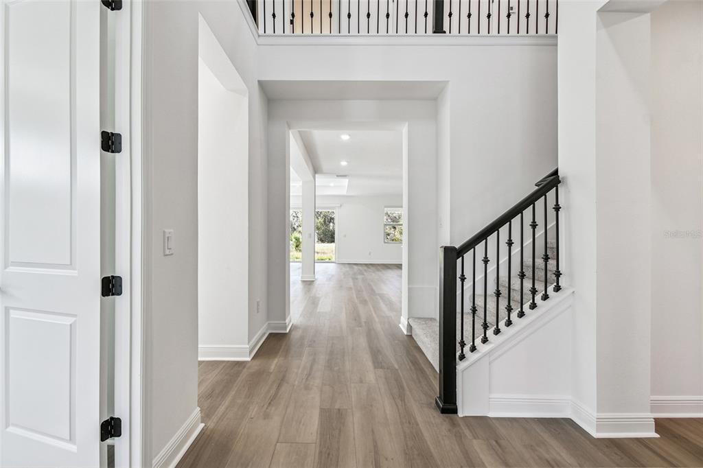 3677 142nd Terrace Parrish, FL 34219 - Photo 66 of 93 a view of a hallway with wooden floor and entryway