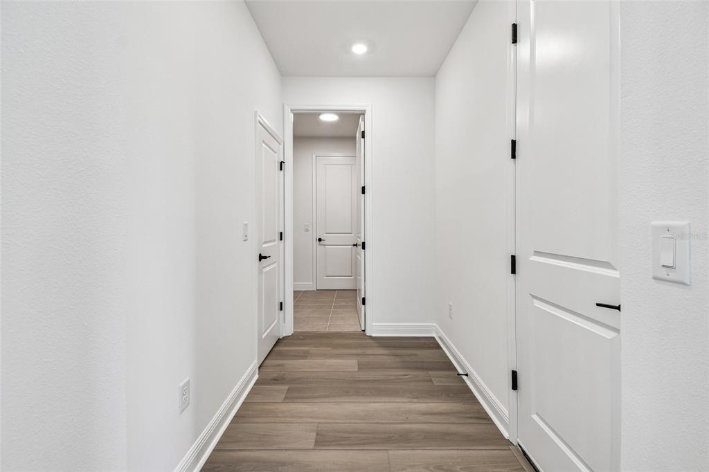 3677 142nd Terrace Parrish, FL 34219 - Photo 75 of 93 a view of a hallway with wooden floor and closet
