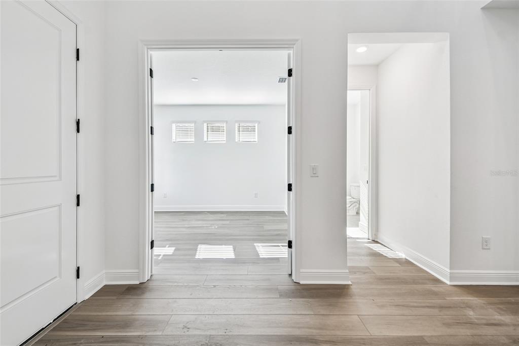 3677 142nd Terrace Parrish, FL 34219 - Photo 76 of 93 a view of front door with wooden floor