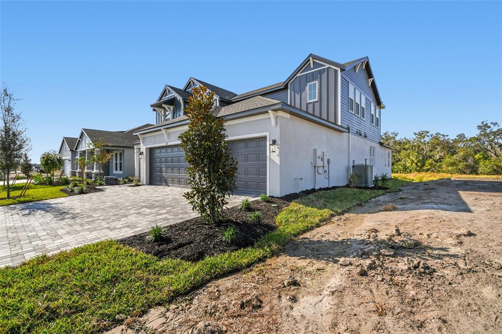 3677 142nd Terrace Parrish, FL 34219 - Photo 84 of 93 a front view of a house with garden