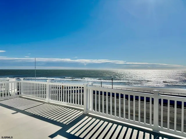 a view of a balcony with wooden floor