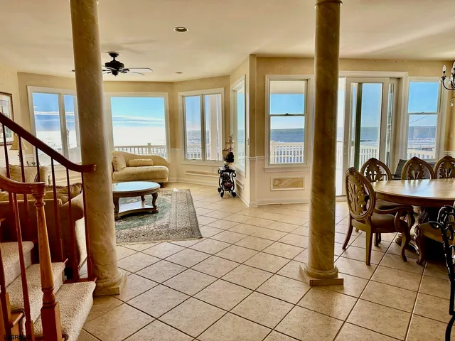 a bedroom with a bed window and a mirror