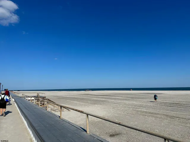 a view of wooden floor with a sitting space