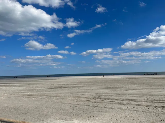 a bedroom with a bed next to a window