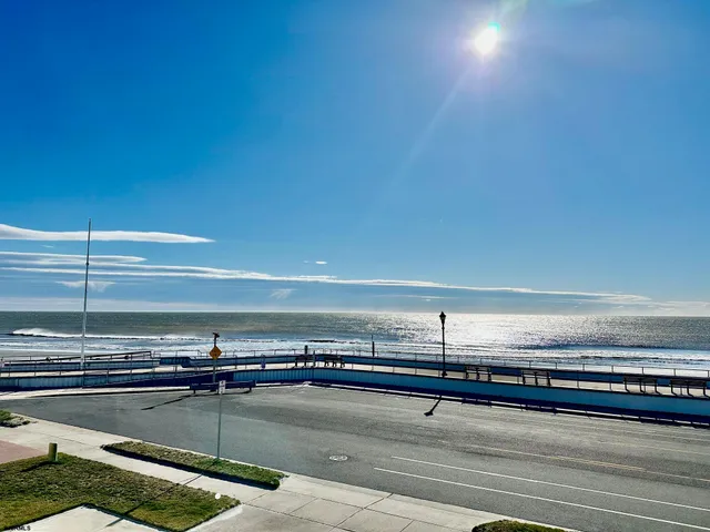 a view of a room with stairs and a floor to ceiling window