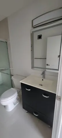 a bathroom with a sink and mirror