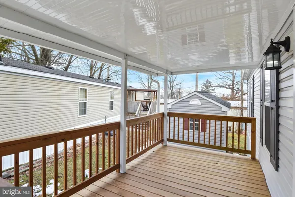 a view of a balcony with wooden floor
