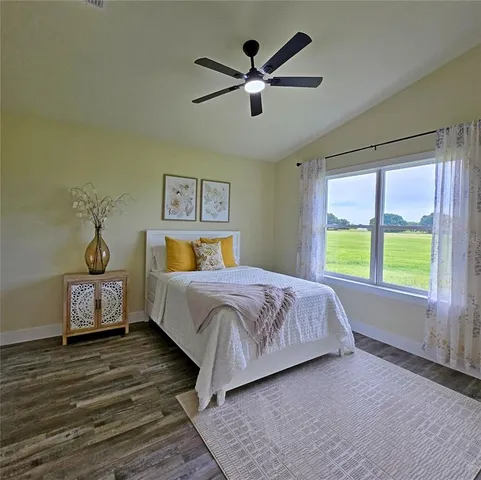 a bedroom with a large bed and a window