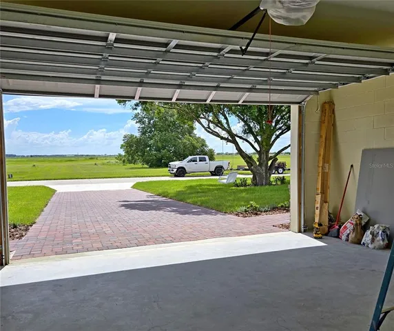 a view of backyard with swimming pool and outdoor space