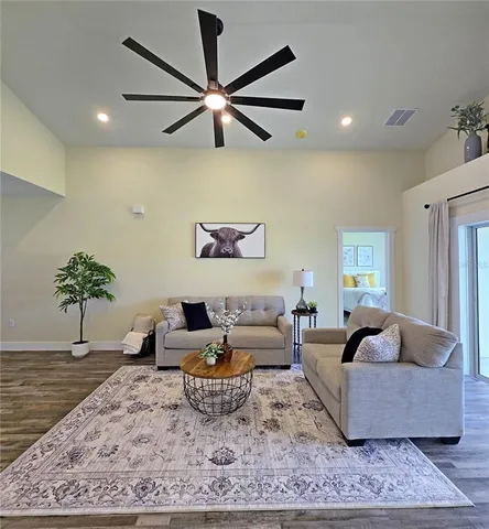 a living room with furniture and a rug