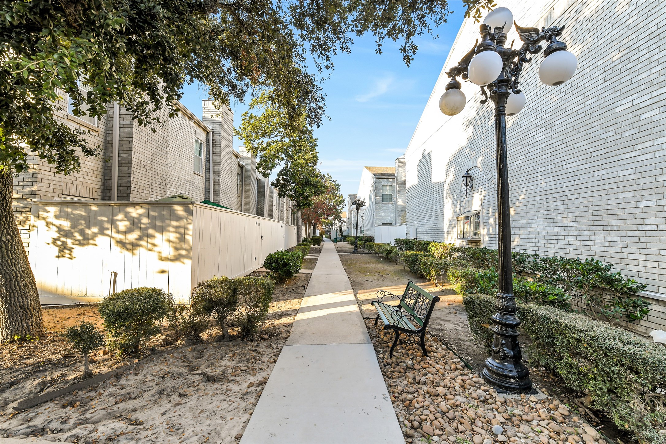 4001 Tanglewilde Street, Unit 1402 Houston, TX 77063 - Photo 21 of 23 Discover the charm of Cadillac Fairview, where impeccably maintained, well-lit walkways complement the elegance of brick buildings that rise from ground to rooftop, creating a timeless and quality living environment.