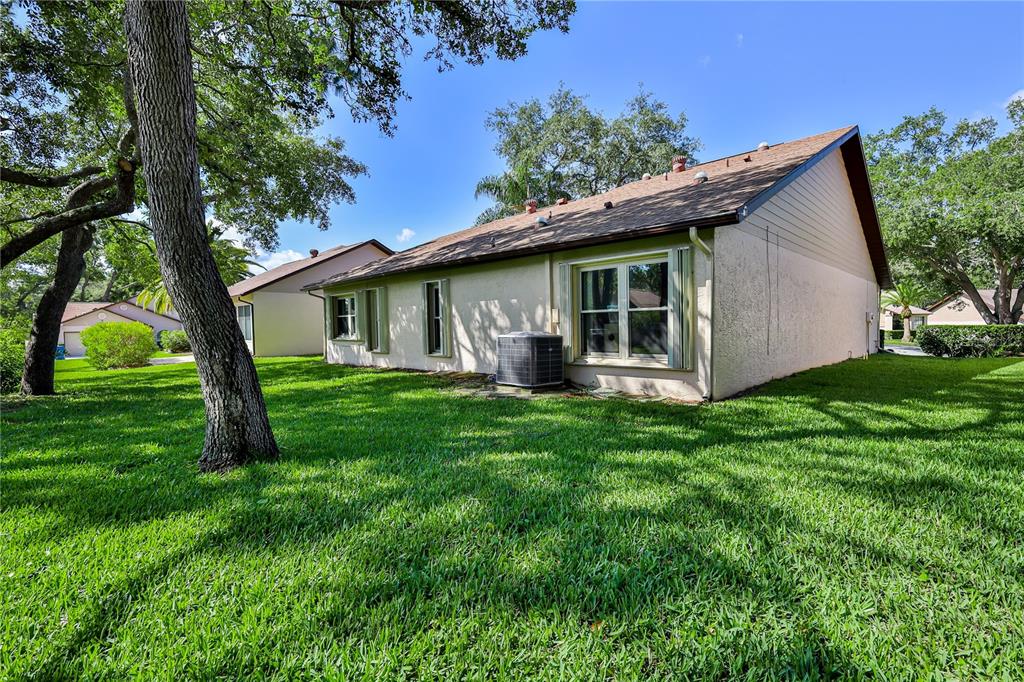 2662 Appleleaf Court Spring Hill, FL 34606 - Photo 33 of 47 a view of a house with backyard and garden