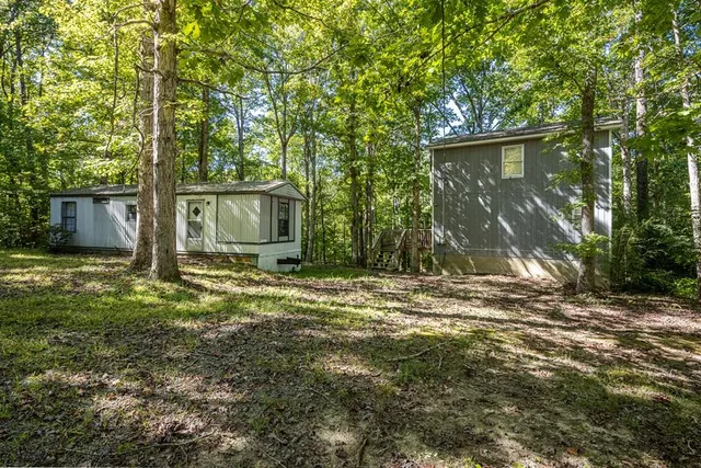 a backyard of a house with lots of green space