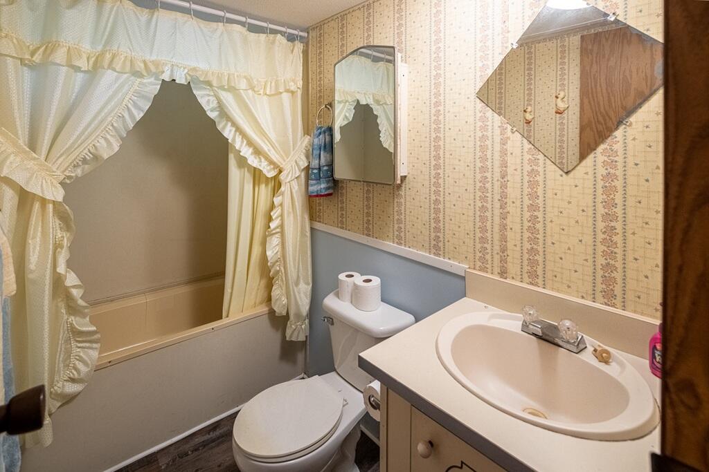 14 Riverview Avenue Buffalo Junction, VA 24529 - Photo 13 of 53 a bathroom with a sink a toilet and shower