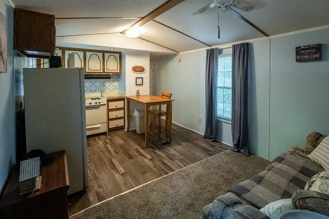 a view of a livingroom with furniture and window