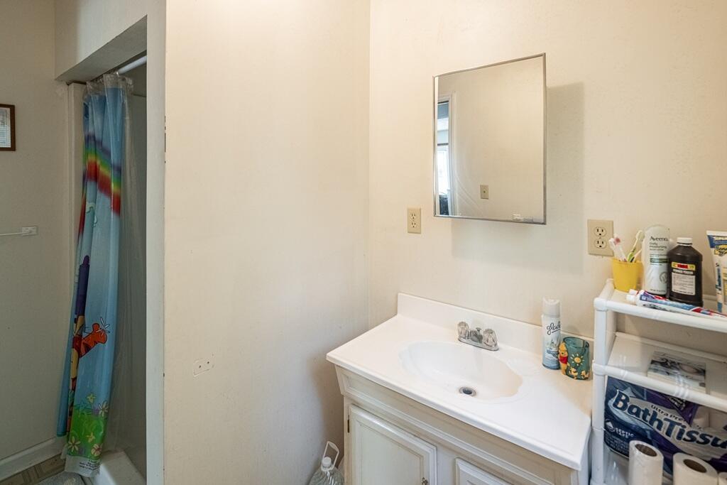 14 Riverview Avenue Buffalo Junction, VA 24529 - Photo 25 of 53 a bathroom with a sink and a mirror