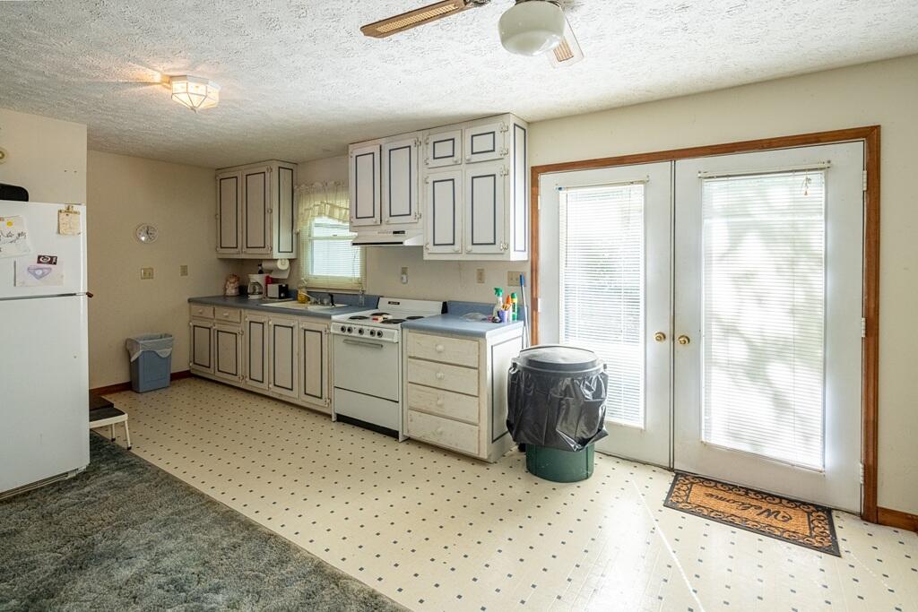 14 Riverview Avenue Buffalo Junction, VA 24529 - Photo 27 of 53 a kitchen with a sink stove and cabinets
