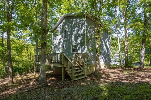 an aerial view of a houses with a lake view