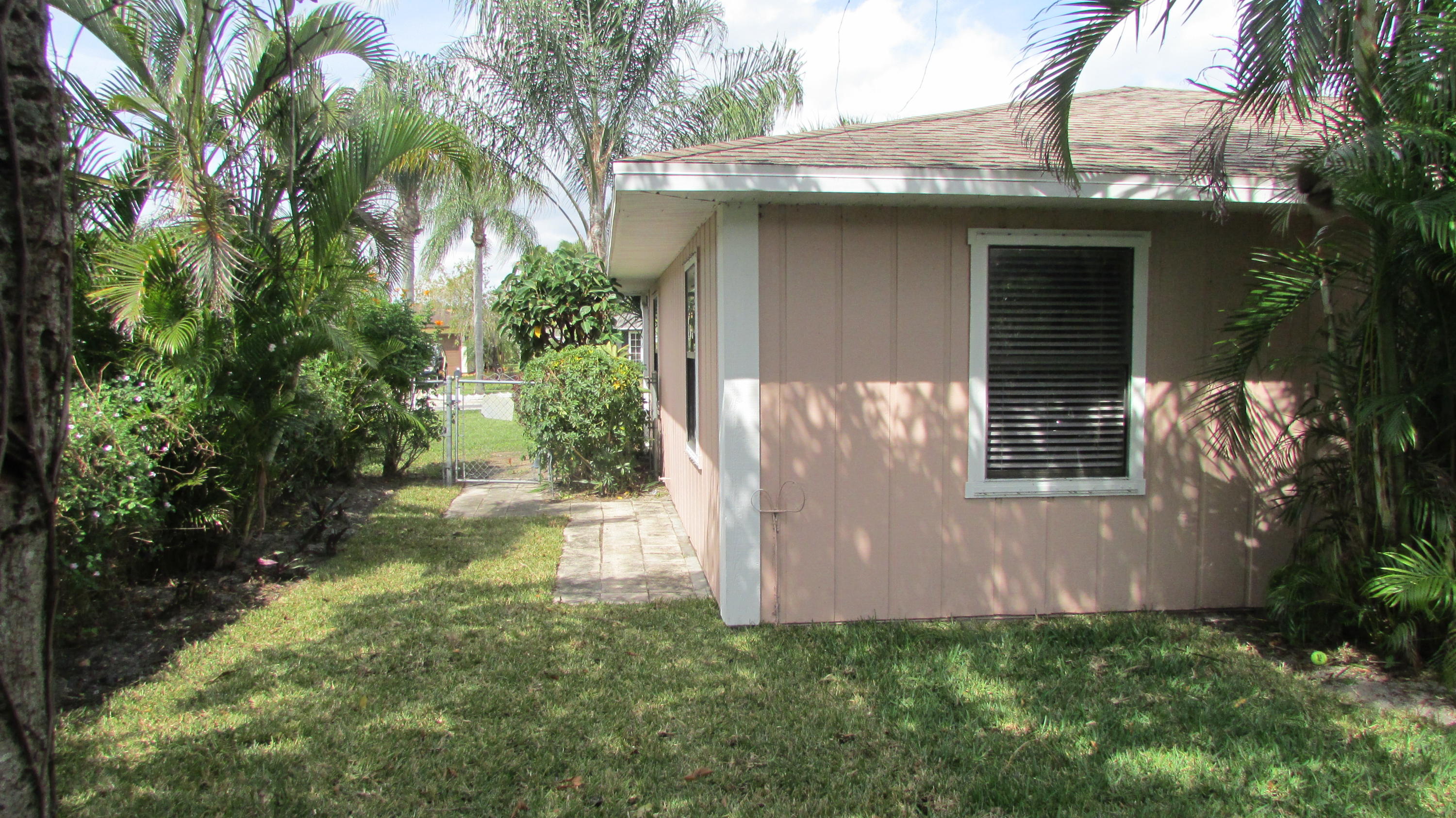 2543 Inisbrook Road Riviera Beach, FL 33407 - Photo 28 of 29 Side of house