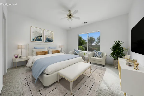 an empty room with windows and ceiling fan