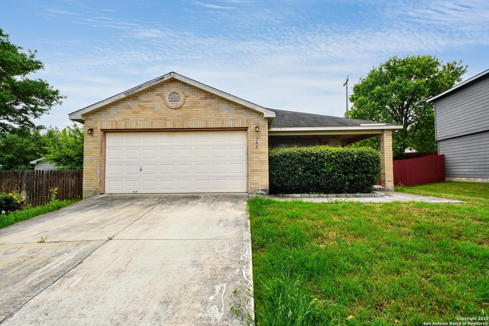 249 Weeping Willow Cibolo, TX 78108 - Photo 1 of 1 a front view of house with garage and yard