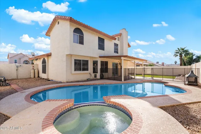 a view of a house with swimming pool