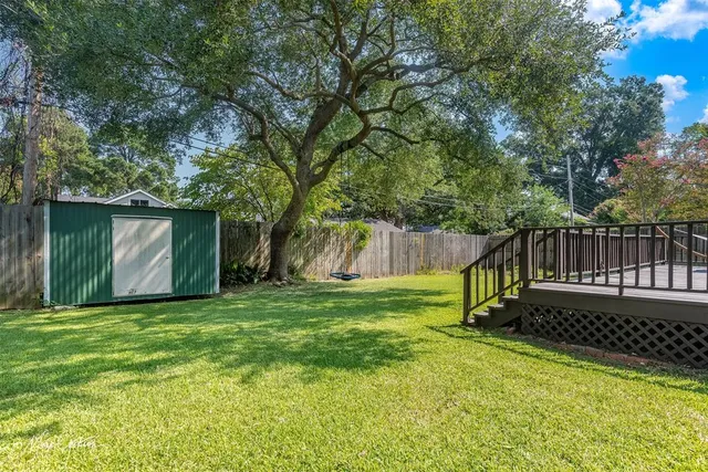 a garden with wooden fence