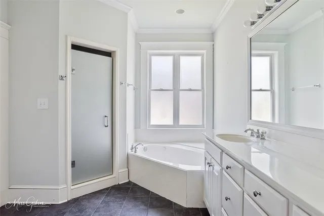 a bathroom with a bathtub and a sink