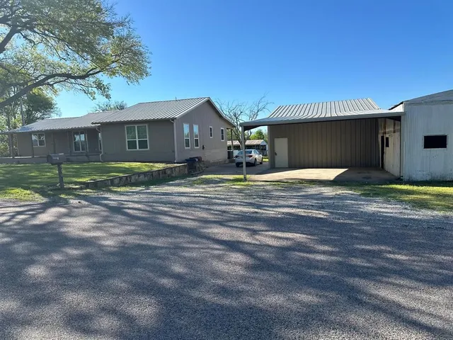 a house with yard in front of it