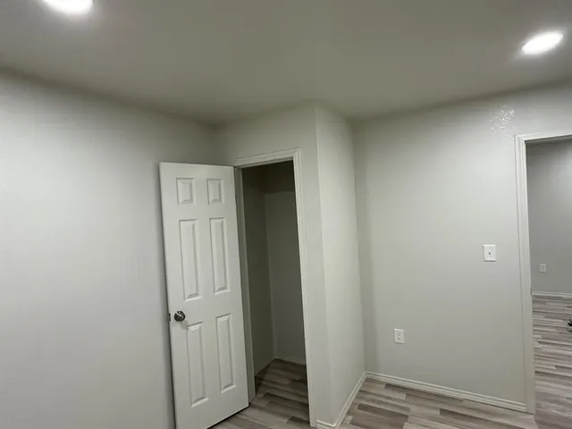 a view of kitchen with refrigerator stove microwave and cabinets