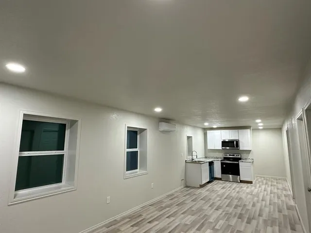 a bathroom with a toilet a sink and shower