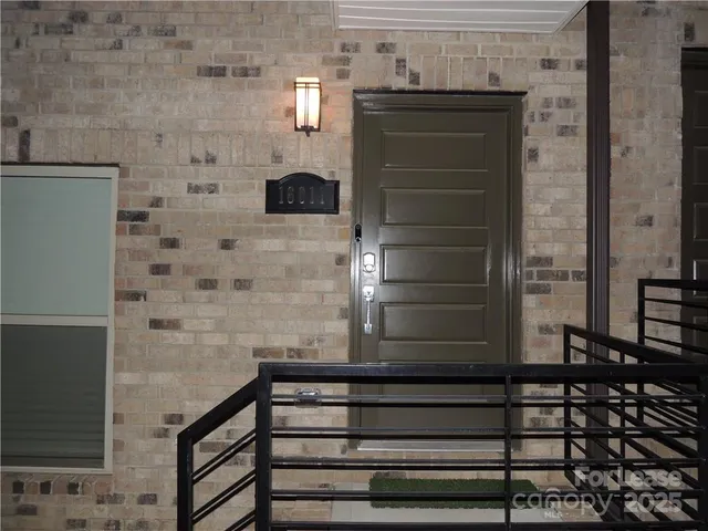 a bathroom with a shower and a sink