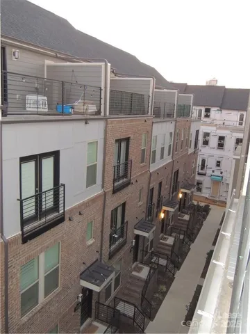 a view of a buildings with many windows