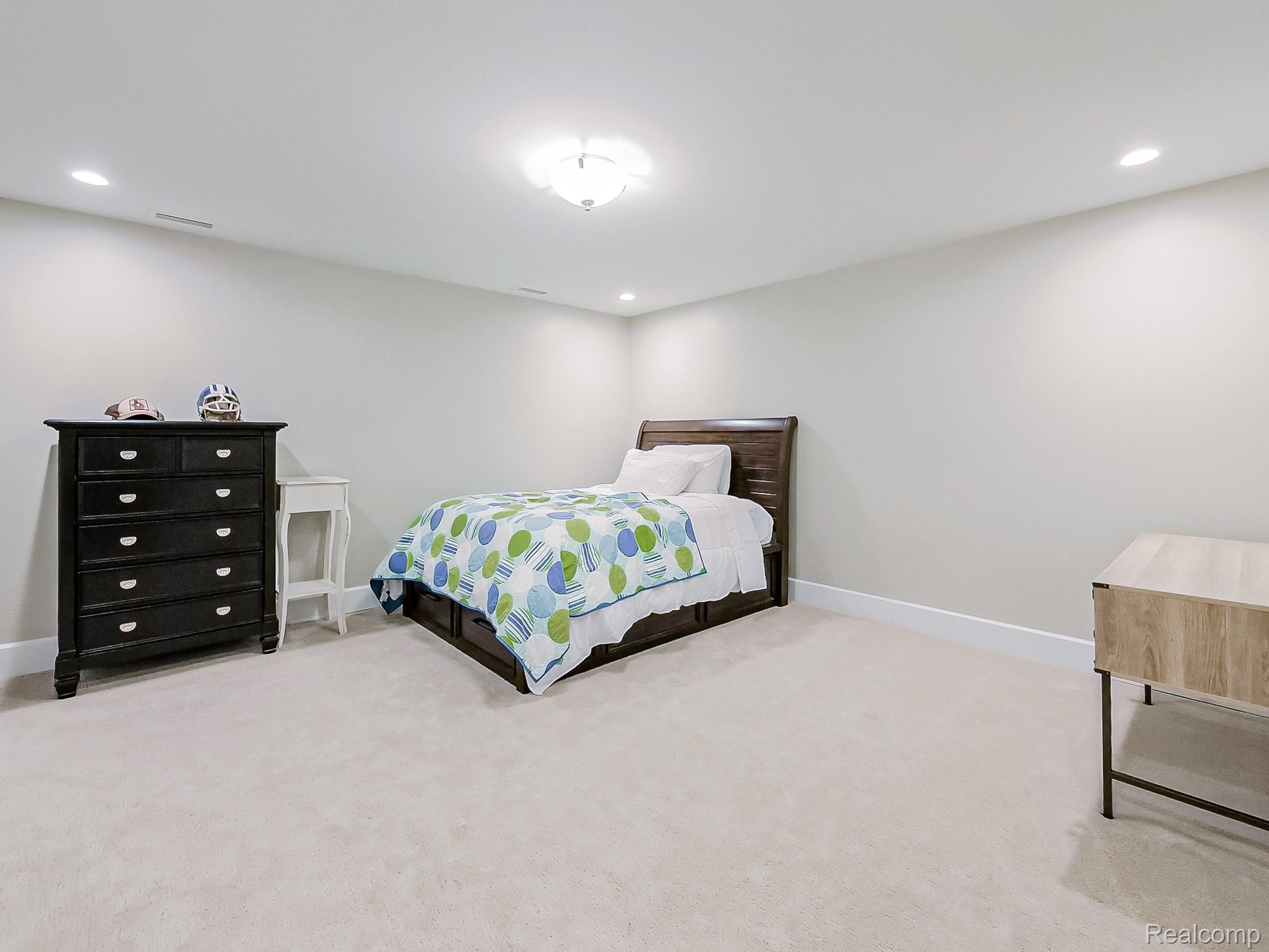 3720 East Clarkston Road Oakland, MI 48363 - Photo 32 of 60 Bedroom with light carpet and recessed lighting