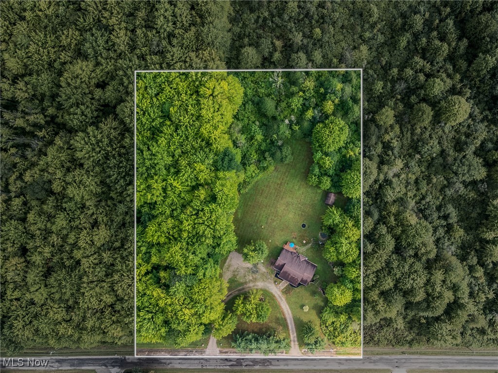 5691 Callahan Road Rome, OH 44085 - Photo 2 of 45 Aerial view of property's location with property boundaries highlighted and a heavily wooded area