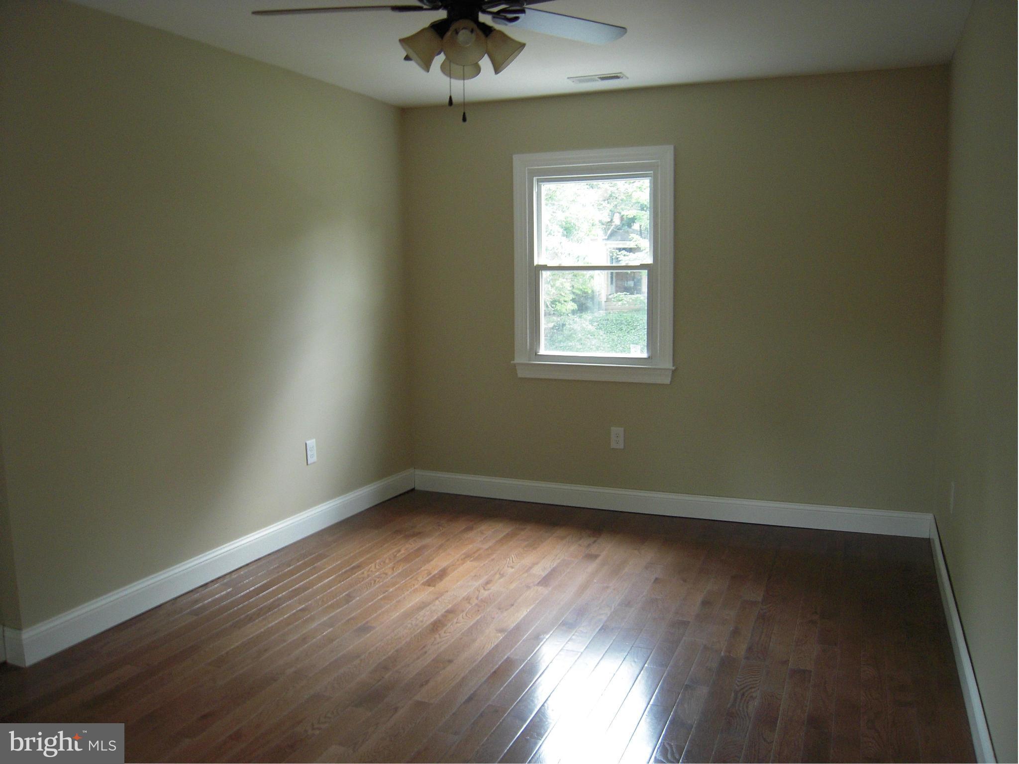 702 Anneslie Road Baltimore, MD 21212 - Photo 6 of 9 Upstairs Bedroom w/ Wood Floors