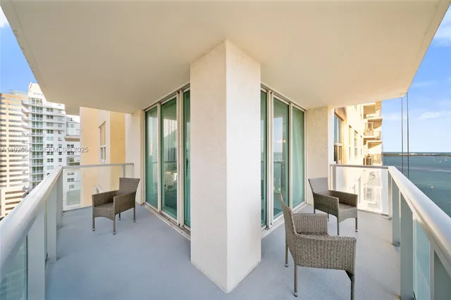 a bathroom with a shower sink vanity mirror and toilet