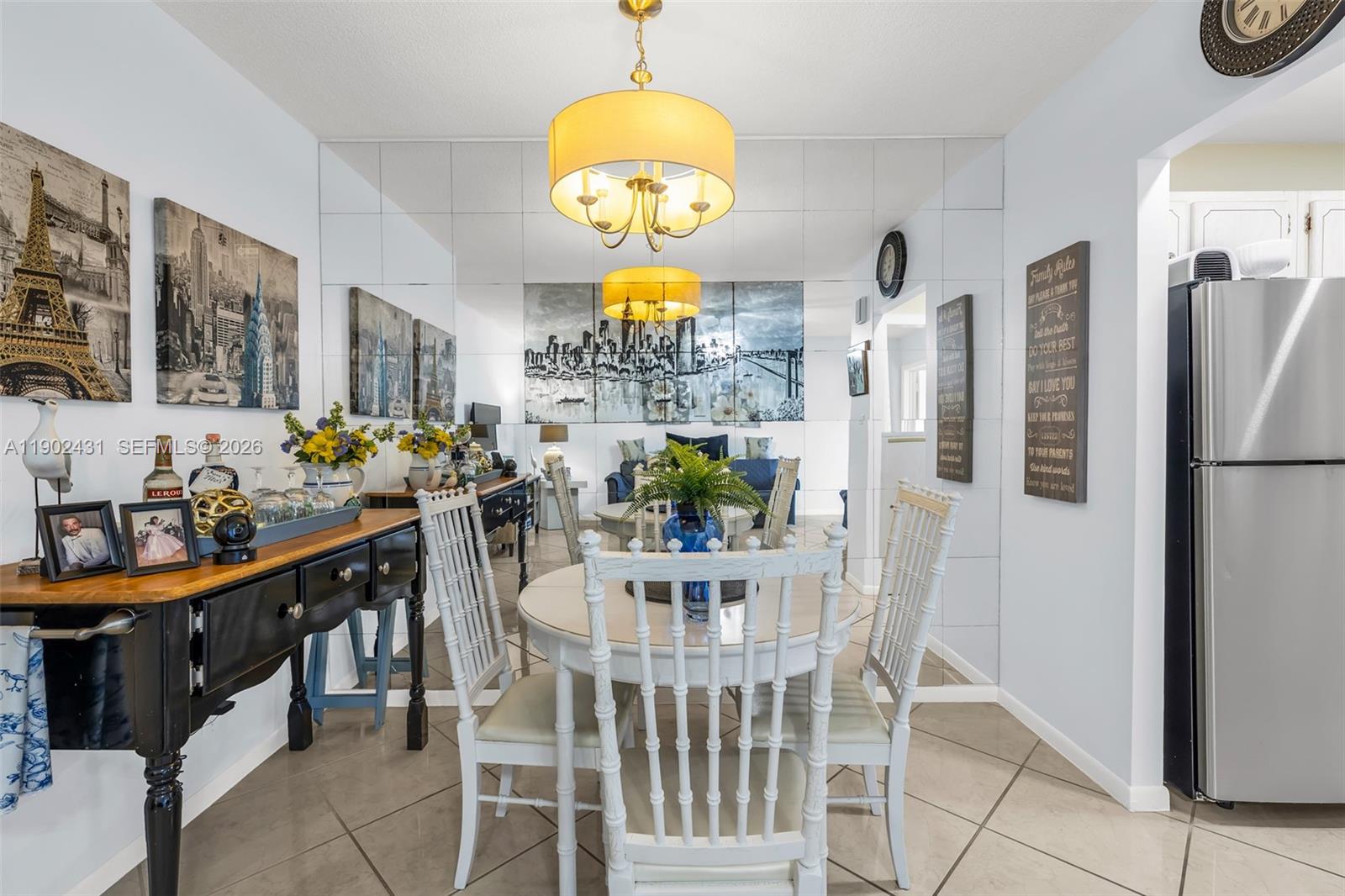 5300 Washington Street, Unit H137 Hollywood, FL 33021 - Photo 15 of 30 a view of a dining room with furniture window and chandelier