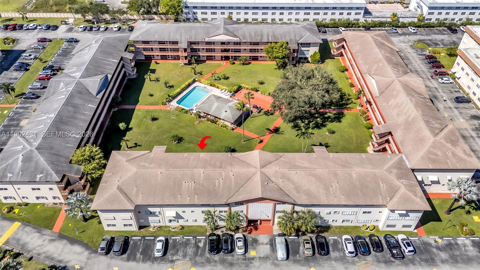 5300 Washington Street, Unit H137 Hollywood, FL 33021 - Photo 2 of 30 an aerial view of a swimming pool with outdoor seating and plants