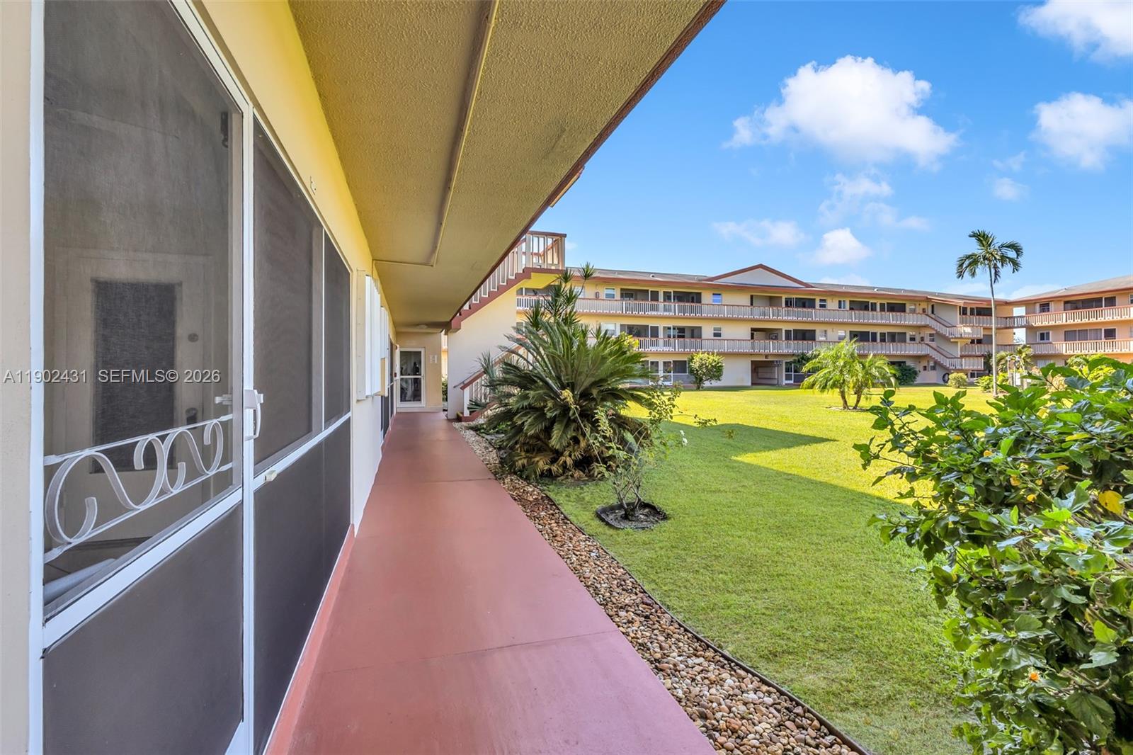 5300 Washington Street, Unit H137 Hollywood, FL 33021 - Photo 7 of 30 a view of a swimming pool with a garden
